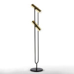 ÉLODIE Gold and Black Floor Lamp with black tuning fork-style frame and two gold canister-style LED lamps on a black circular base. Measures 22x22x120 cm. Bulbs not included.