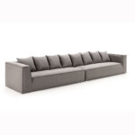 COCO 4-Seater Charcoal Grey Sofa with premium textile, chunky design, tapered arms, and eight back square cushions, dimensions 440x110x77cm.