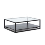 LANDO Cedar Wood and Glass Coffee Table with a clear toughened glass top, Cedar wood bottom shelf, and black-painted steel frame. Measures 120x90x40 cm.