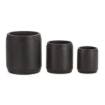 Set of three black cylindrical cement planters in descending sizes, showcasing a modern and minimalist design