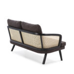 Dark fabric two-seat sofa with natural rattan accents and a modern, compact design