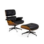 SILVANO Leather and Ashwood Lounge Chair with a beautifully grained ashwood back, sleek black leather upholstery, and metal claw-style rotating bases, complete with a matching footrest.