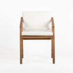 NICOLAS Sand Fabric and Teak Wood Armchair featuring a modern angled design with sand-coloured cushions and a sturdy teak frame for outdoor use.