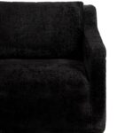 Plush black fabric armchair with a modern, boxy design