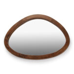 Asymmetric oval mirror with warm walnut wooden frame against white background