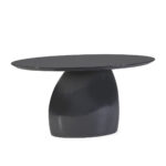 GALIA Dining Table featuring an oval black fibreglass top and a uniquely shaped black fibreglass base, embodying modern sculptural design