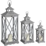 Set of Three Wooden Lanterns with a traditional cross-section design and natural wood grain. Shop now at www.louisandhenry.co.uk.