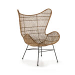 INGLEWOOD Wingback Rattan Armchair with bowl-shaped seat, natural woven rattan, and black metal base. Shop now at Louis & Henry. www.louisandhenry.co.uk