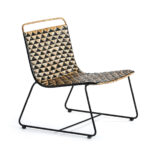 HAWTHORNE Wicker Chair with a natural and black woven wicker seat and black metal sled base, perfect for mid-century modern or bohemian decor.