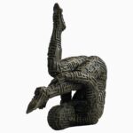 DALI Abstract Bronze Yoga Sculpture featuring a suspended male figure in a textured geometric design, stained in brown patina.