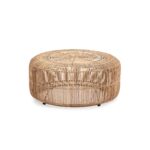 Round whitewashed rattan pouf with intricate open-weave design, suitable for bohemian, coastal, or modern interiors.