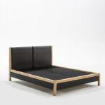 FIORENTE wood and leather bed with black faux leather headboard, showcasing a sleek modern design.