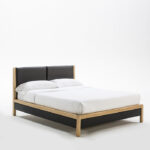 FIORENTE wood and leather bed with black faux leather headboard, showcasing a sleek modern design.