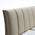 LATHORN ash wood and leather bed with curved headboard and natural wood frame, perfect for modern interiors.