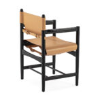 TALIA Dining Chair with tan leather upholstery and black wood frame, featuring a strap and buckle design.