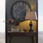 retro wall clock, black and brass clock, stylish large clock, bold clock design, contemporary timepiece.