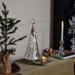 CHRISTMAS IMAGE. Larger handmade glass Christmas tree decoration with a silver star on top. WWW.LOUISANDHENRY.CO.UK