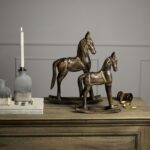 Classic brown wooden rocking horse, ideal for rustic or vintage-style decor.