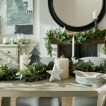 lifestyle christmas image. Pine Garland featuring lifelike green pine branches, perfect for holiday or year-round decor.