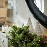 lifestyle christmas image. Pine Garland featuring lifelike green pine branches, perfect for holiday or year-round decor.