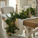 lifestyle christmas image. Pine Garland featuring lifelike green pine branches, perfect for holiday or year-round decor.