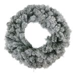 Snowy pine wreath with lifelike frosted branches for a holiday display.