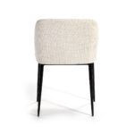 ARIS Dining Chair in cream upholstery with black metal legs and a curved backrest.