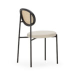 ROCHER Rattan Dining Chair with beige fabric upholstery and black metal frame, featuring a rattan cane backrest.