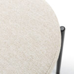 ROCHER Rattan Dining Chair with beige fabric upholstery and black metal frame, featuring a rattan cane backrest.