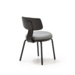 AUSTEN Chair in Black and Grey with a wooden backrest, light gray fabric seat, and black metal legs – modern and minimalist design.