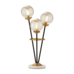 AUREUM Globus 3-light table lamp with brass accents, black metal rods, and a marble base.