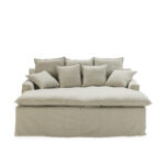 Eden Snuggle Sofa with beige upholstery, three large back cushions, and four smaller cushions for a cosy and inviting seating experience.