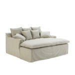 Eden Snuggle Sofa with beige upholstery, three large back cushions, and four smaller cushions for a cosy and inviting seating experience.