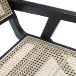 Akita Black Rattan Dining Armchair with sleek black frame and natural woven rattan seat and backrest.