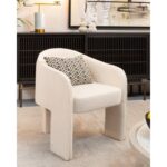 Off-white boucle dining chair with integrated armrests and wide upholstered legs, perfect for modern dining rooms or accent seating.