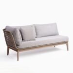 Elevate your outdoor space with the OSANA Single Arm Eucalyptus Wood Outdoor Sofa. Featuring greyish eucalyptus wood legs and cement-colored rope, this versatile piece can be used alone or paired with other OSANA range items for a modern look.