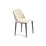 ARIS Dining Chair in cream upholstery with black metal legs and a curved backrest.