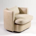 BELVOIR Off-White Leather Armchair with semicircular backrest, black metal frame, and plush cushions for modern interiors.