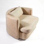 BELVOIR Off-White Leather Armchair with semicircular backrest, black metal frame, and plush cushions for modern interiors.