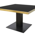 GERMAIN Dining Table with brushed gold stainless steel frame and black iron base.