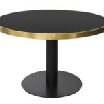 PIGALLE Dining Table with brushed gold frame, black glass top, and black iron pedestal base.