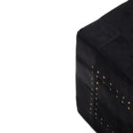 MILO Pouffe with black cowhide leather patchwork design and metallic stud details, perfect as a stylish and versatile accent piece.