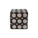 Cube-shaped OWEN Pouffe with light oatmeal jacquard, dark brown leather hexagonal patterns, and bold black zig-zag stitching.