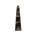Large black marble obelisk with sleek lines and white veining, offering a modern and luxurious addition to contemporary interiors.
