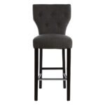 SABINA Charcoal Barstool with soft charcoal fabric upholstery, diamond-button backrest, sturdy black rubberwood legs, and sleek metal footrests.