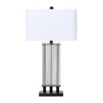 EDEN Table Lamp with ribbed glass rods, a matte black metal base, and an ivory shade, offering timeless elegance for modern interiors.