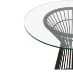 Round NIXON dining table with a clear glass top and matte black stainless steel geometric base, exuding modern retro charm.
