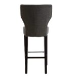 SABINA Charcoal Barstool with soft charcoal fabric upholstery, diamond-button backrest, sturdy black rubberwood legs, and sleek metal footrests.