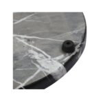 A round black marble LANDRA Chopping Board with unique veining, perfect for chopping and serving in style.