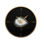 SAUL Clock with a sleek black face, gold accents, and minimalist design, ideal for modern interiors.